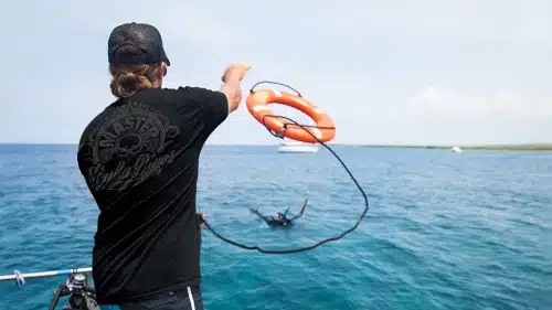 PADI Rescue Diver training with diver practicing rescue skills in open water in Bali