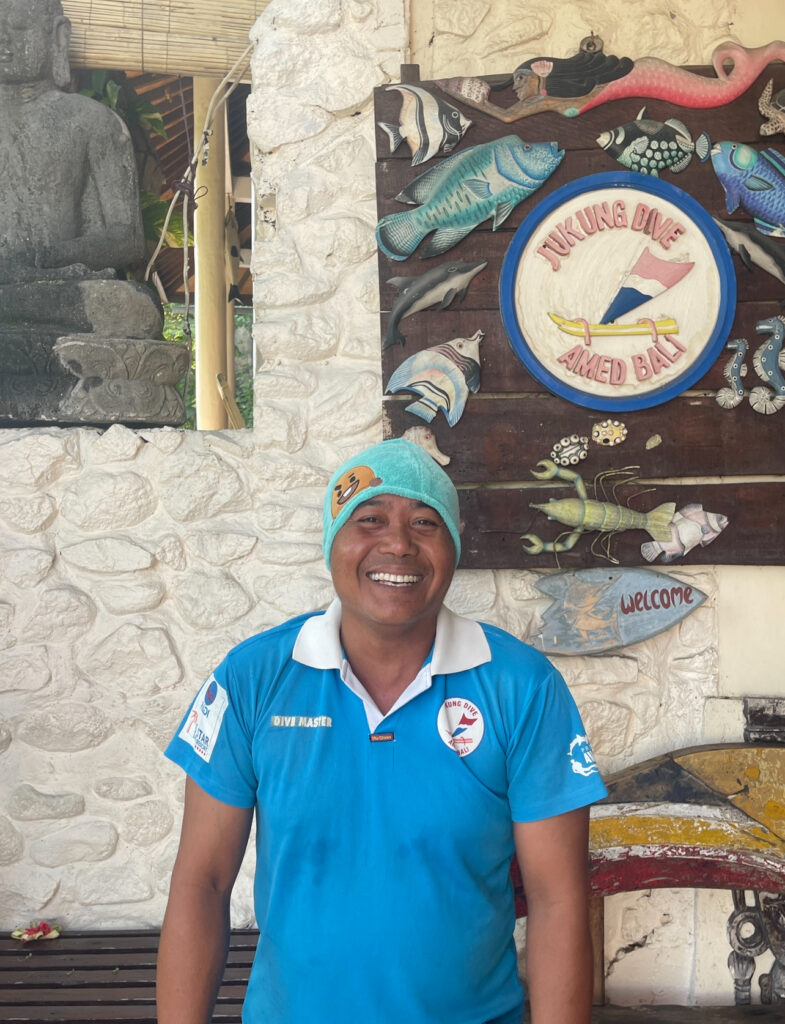 Jukung Dive Bali team member smiling at the dive centre in Nusa Penida