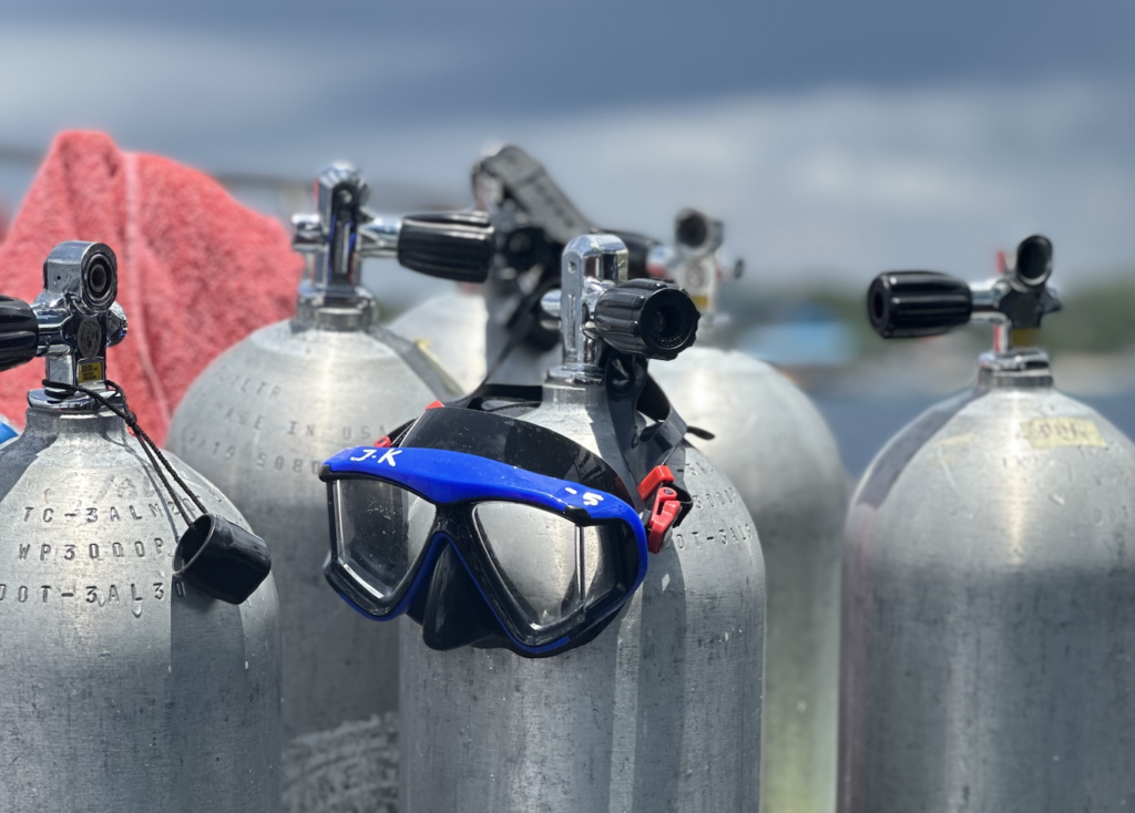 Tanks and mask on dive boat in Nusa Penida showing gear on the boat