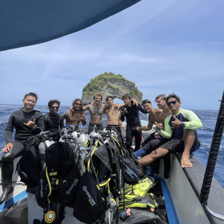 Certified scuba divers boarding a dive boat in Nusa Penida Bali