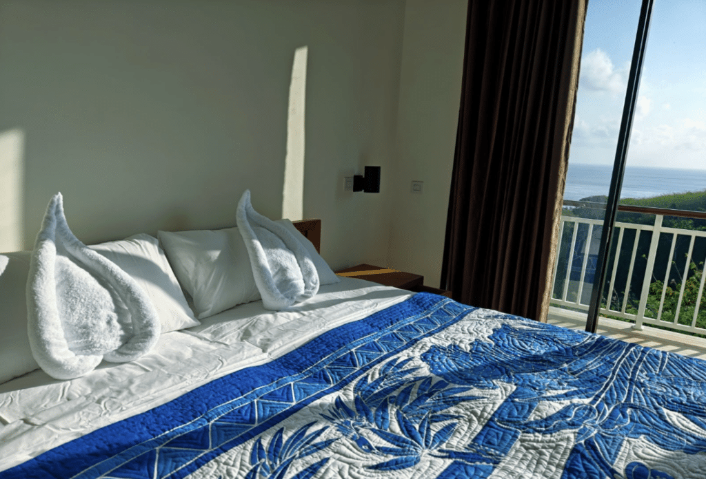 Twin Room with Sea View at Jukung Dive Resort Nusa Penida with two single beds, private sea-view balcony, and comfortable accommodation for dive buddies visiting Bali.