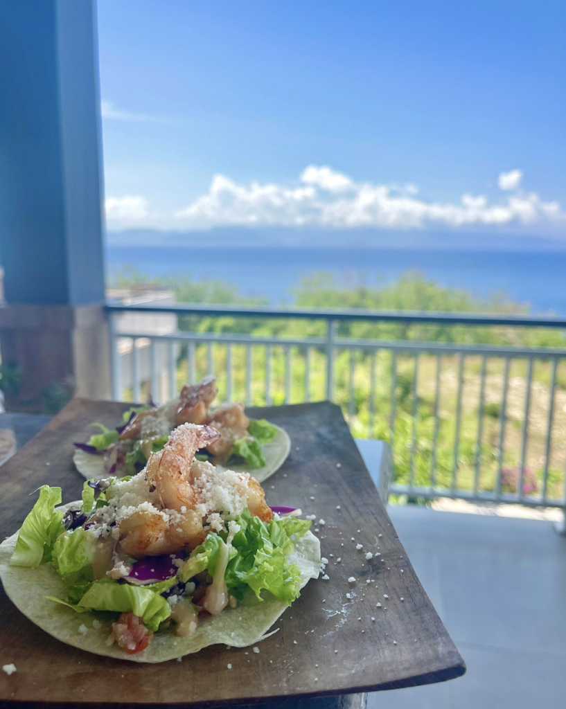 Fresh seafood salad served at Sky Penida Rooftop Restaurant with stunning ocean views in Nusa Penida, Bali.