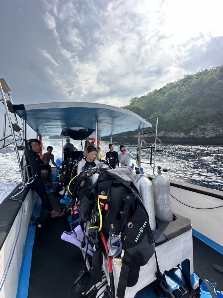 Scuba divers preparing for a boat dive at Nusa Penida, Bali, before exploring world-class dive sites with Jukung Dive Resort.