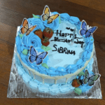 Suprise birthday cake for Jukung Dive Guests organised by the team with butterflies on