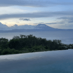 Infinity pool with sea and mount agung overlooking